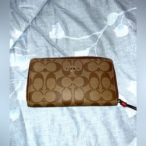 Brown Coach wristlet wallet. New without tags, never used.